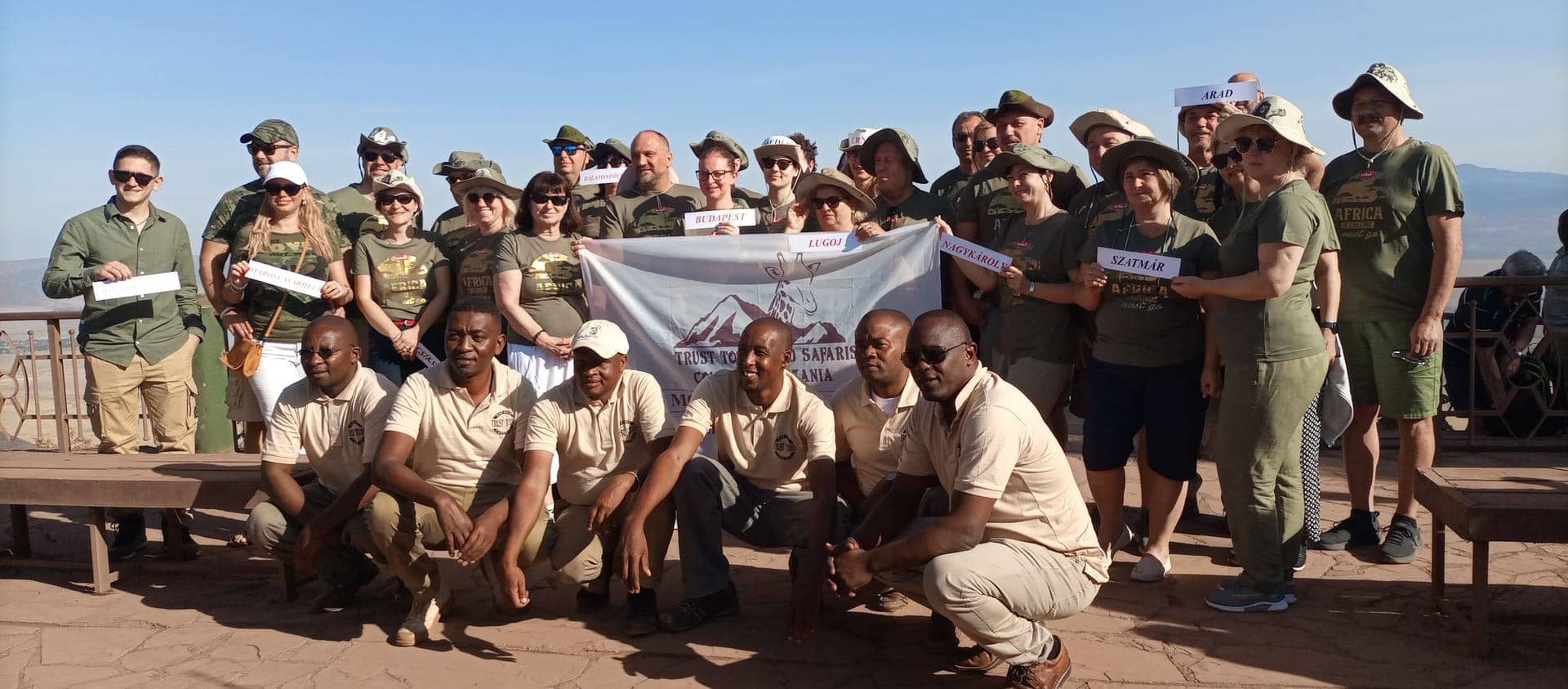 A large international group with the crew at the Ngorongoro Crater rim