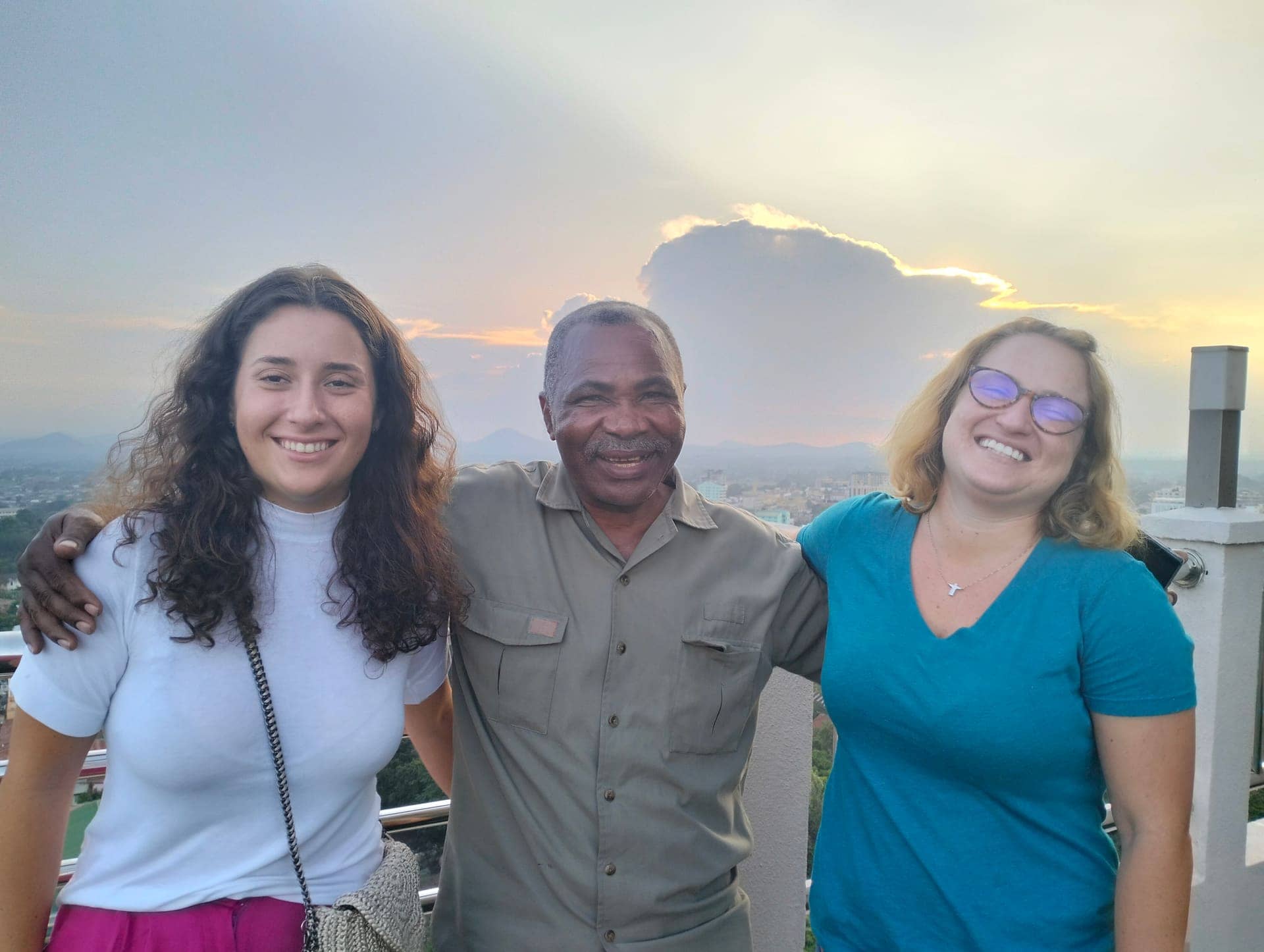 Guests and their guide at a safari lodge at sunset